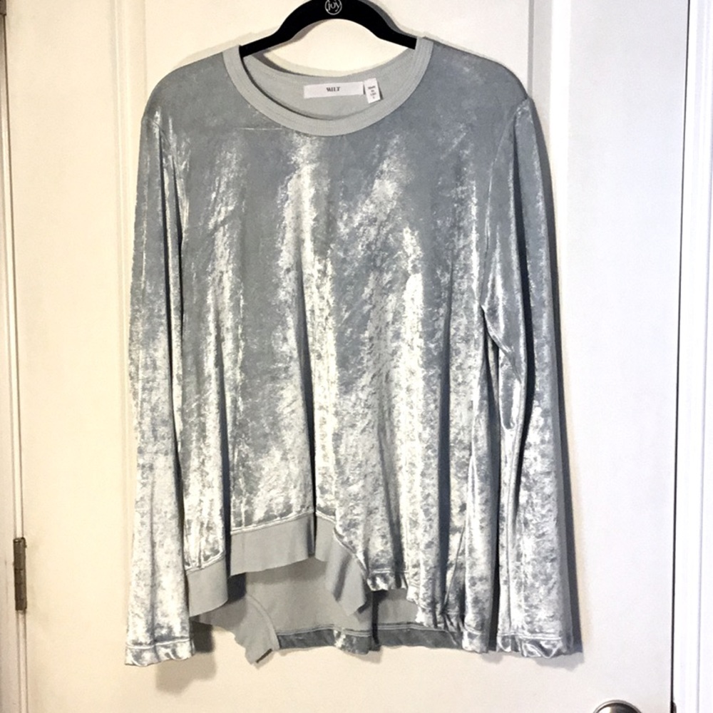 Baby blue velour shirt with detailed hem.